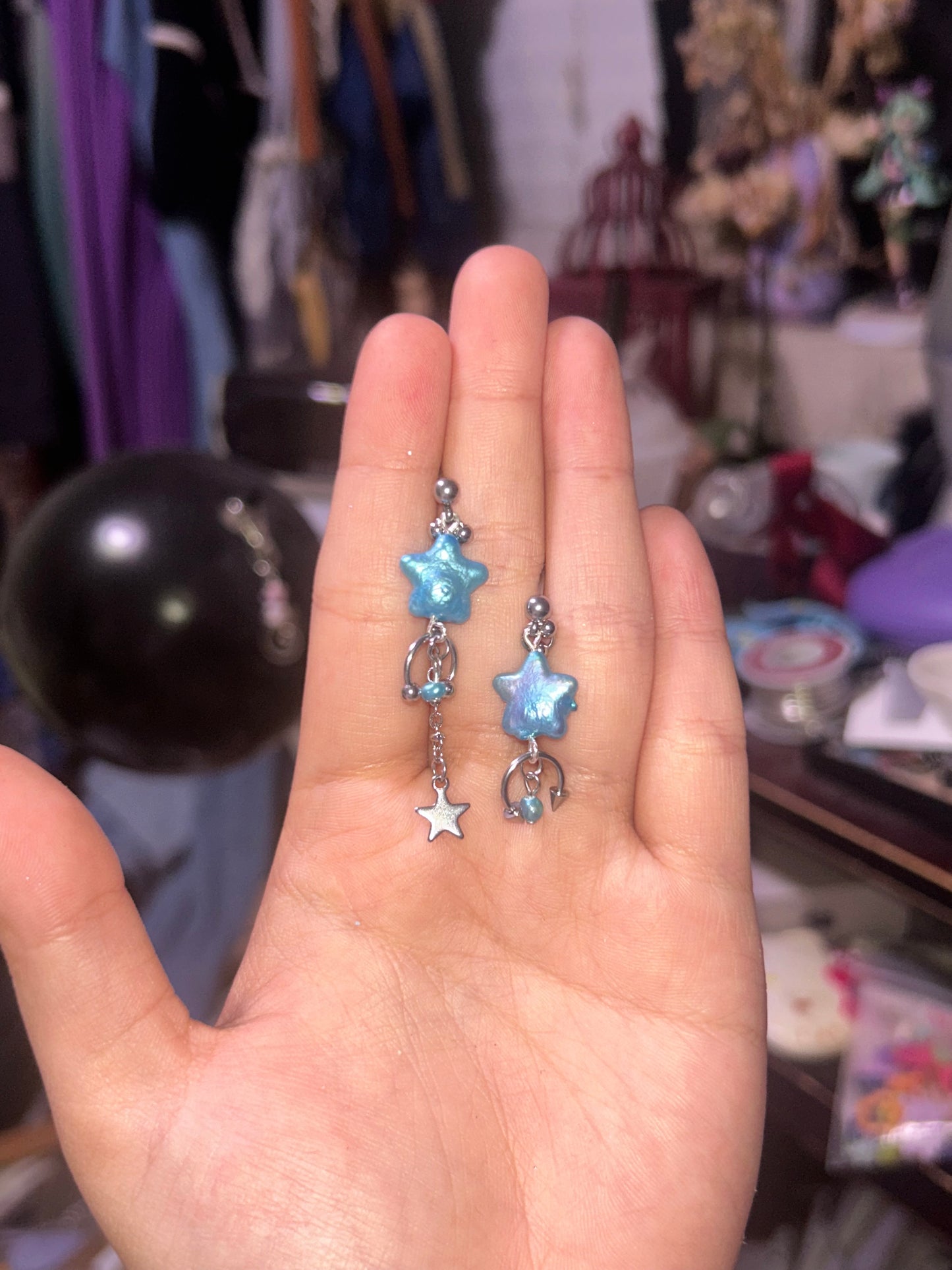 button blue shooting star studs