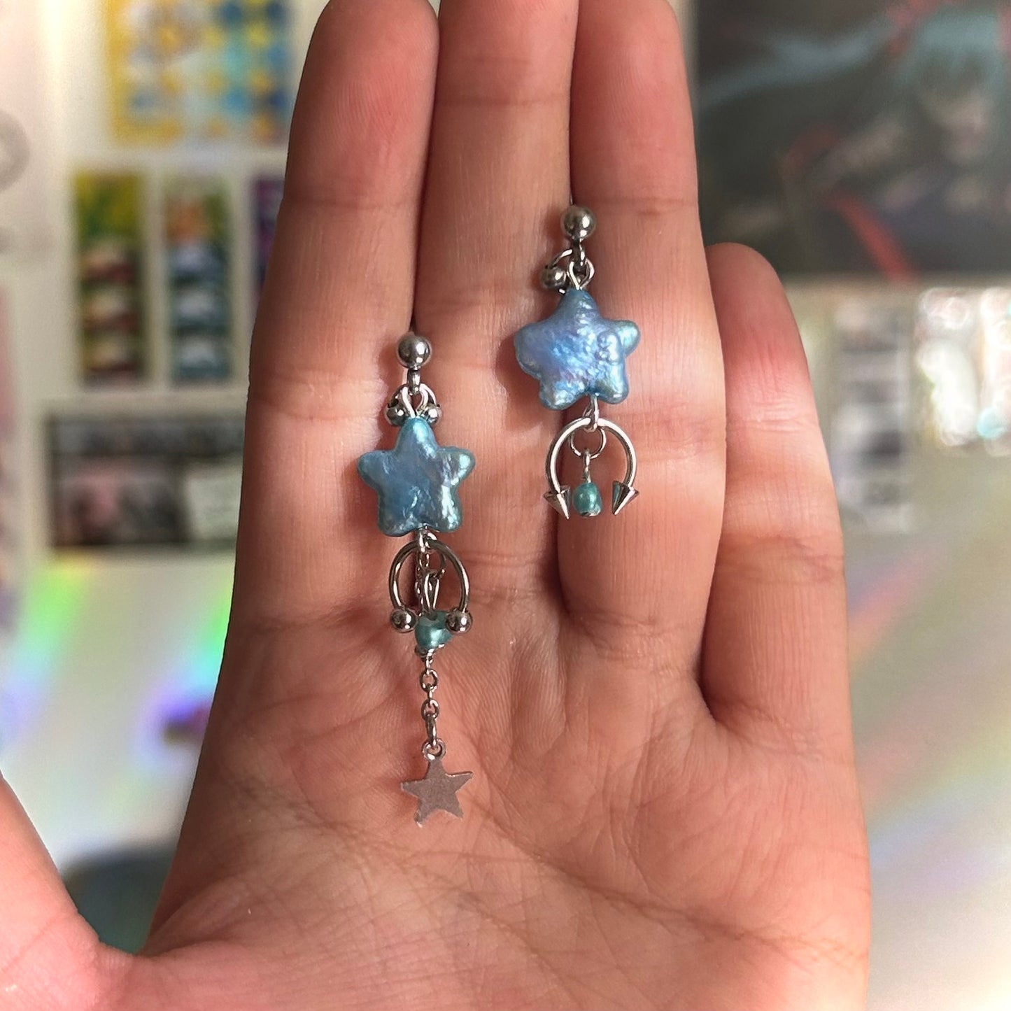 button blue shooting star studs