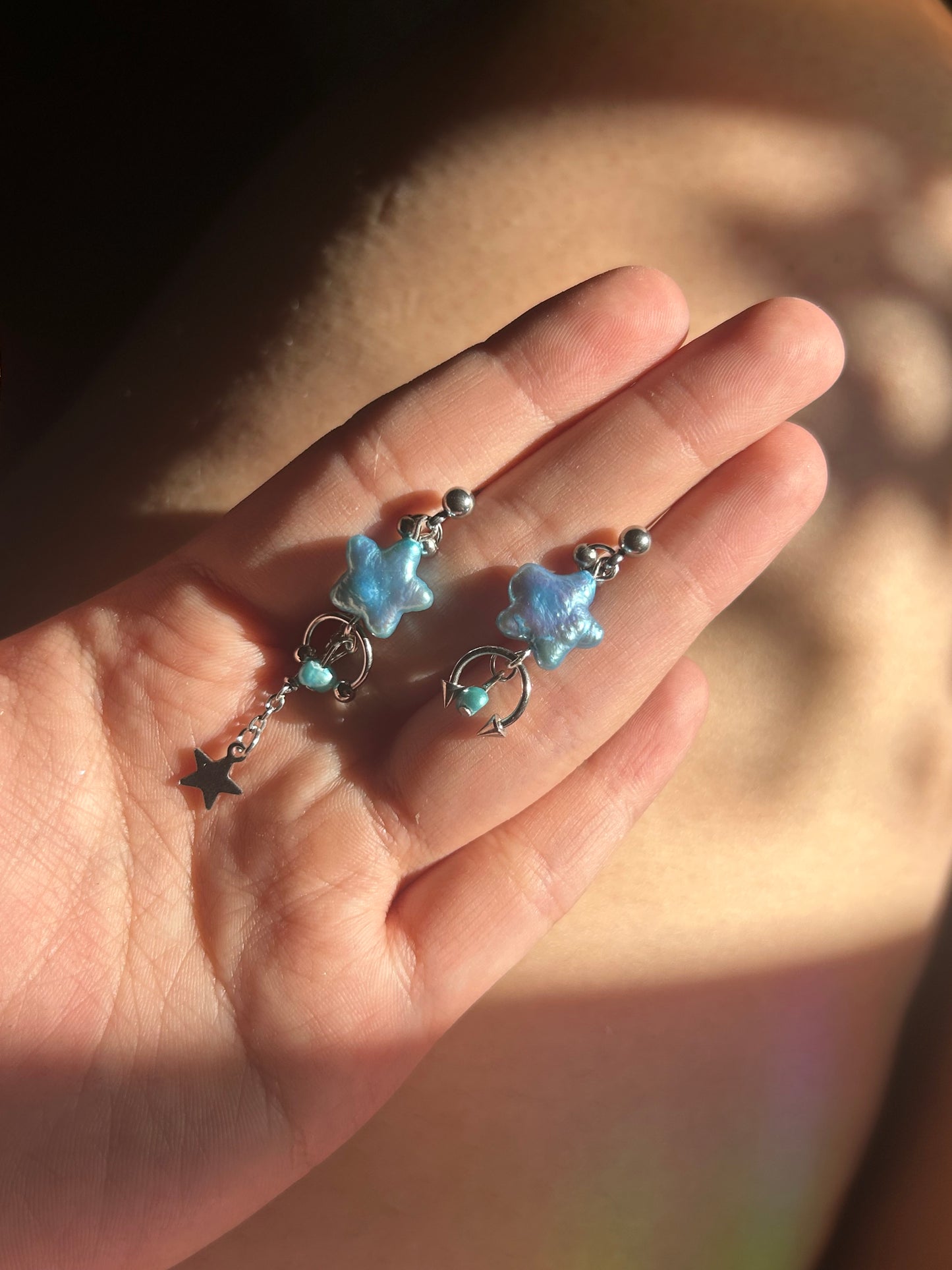 button blue shooting star studs